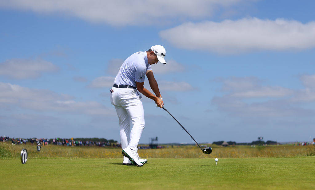 Collin Morikawa tees off down the 13th